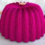 Knitted tea cozy with a Stockinette pattern formed by repeated knit stitches